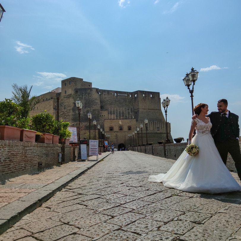 Just married couple at front of Ovo Castle, Napoli